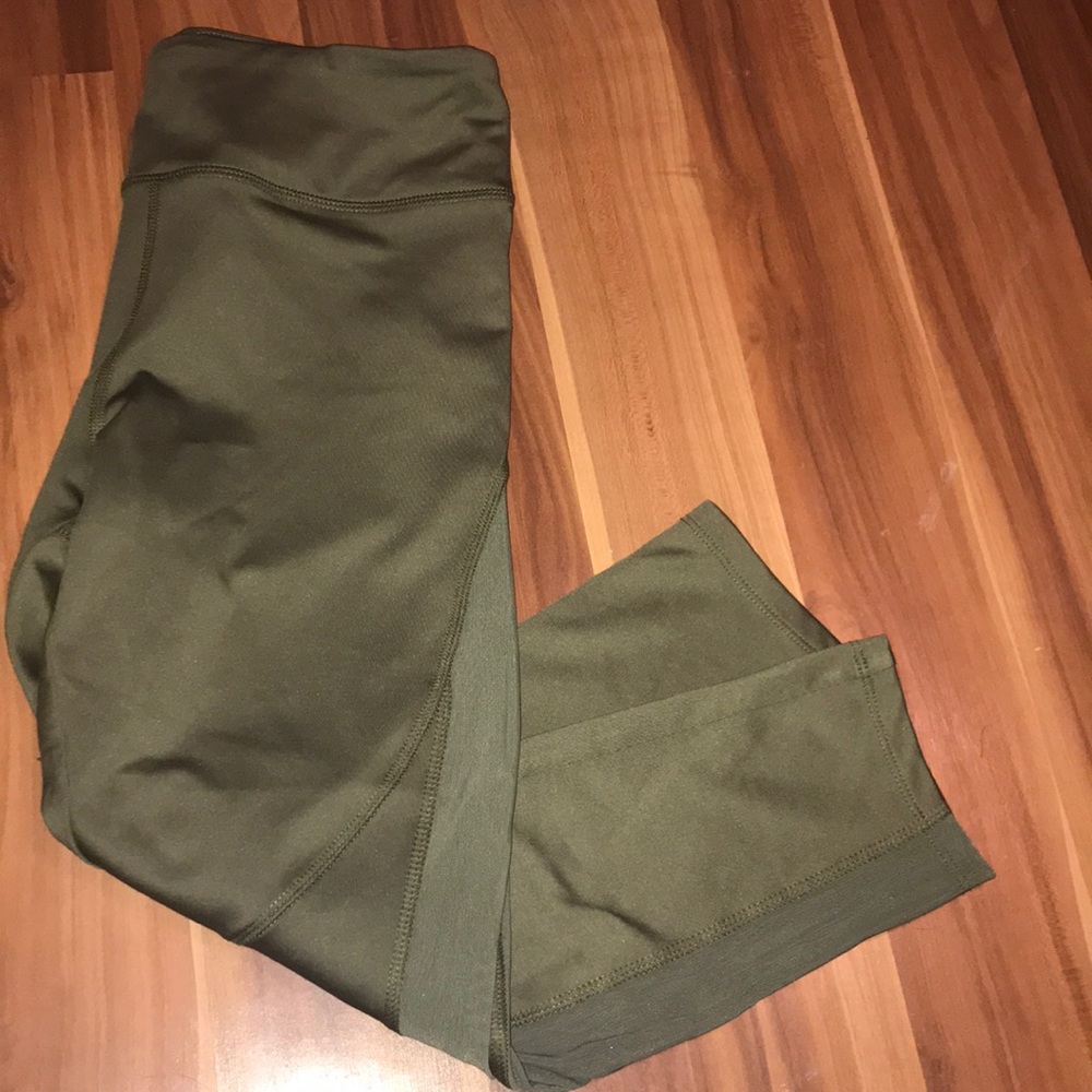 Forest green athletic pants with breathable sides